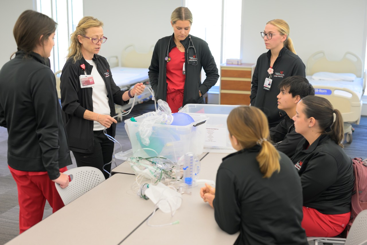 students and instructor in simulation lab
